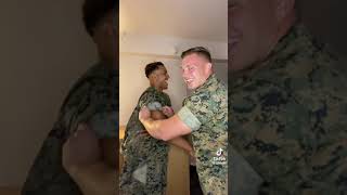 Militar men needs help taking shirt off