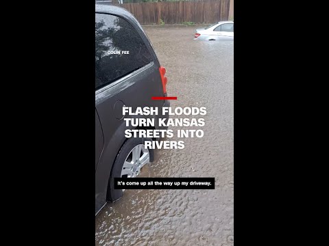 Cars and roads submerged in water during record rainfall in Kansas