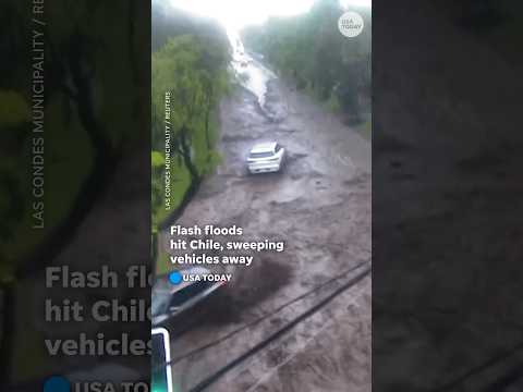 Flash floods swamp streets in Chile, carrying away vehicles