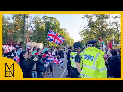 Police forced to step in as protesters clash outside Manchester hotel