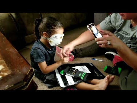 Would you shop blind? Clothes raise money for cure
