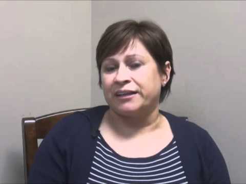 Woman speaking in interview setting.