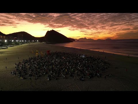 Sunrise stretch: Hundreds flock to Copacabana Beach for post-Yoga Day celebration | AFP