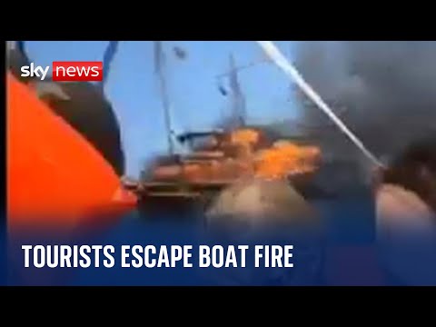Greece: Tourists evacuated after wooden boat catches fire off coast