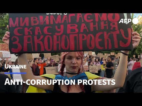 People gather in Kyiv to protest against law curbing anti-graft agencies | AFP