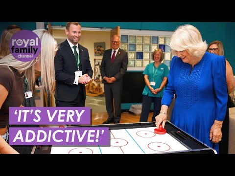 Queen plays air hockey in children’s hospice