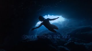 Down towards the light: Anna-Karina freediving a very dark cave