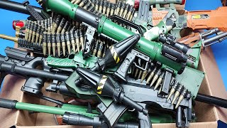 Box of military guns toys & Airsoft / AK-47,1911,cal45,Rocket Launcher...