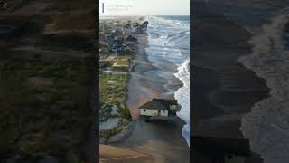 Drone footage shows waves reaching some beach homes in North Carolina, ahead of Hurricane Erin.