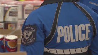 YouTube video thumbnail: Metro Area Police Departments Help Feed Families at Atlanta Community Food Bank