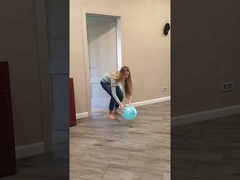 Tanya brings a blue balloon to the dogs