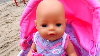 Baby Born playing and trying new dress