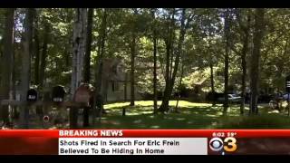 Armed officers comb ambush suspect's woods