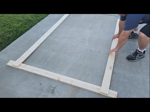 He lays long wood on his sidewalk for this BRILLIANT entryway idea!