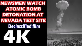 NEWSMEN WATCH ATOMIC DETONATION AND MUSHROOM CLOUD
