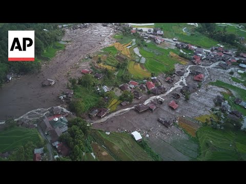 YouTube video thumbnail: Relatives of Indonesia Flood Victims Await News of Loved Ones