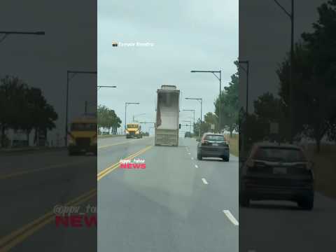 Dump truck with its bed raised strikes traffic signal Fredrick Maryland