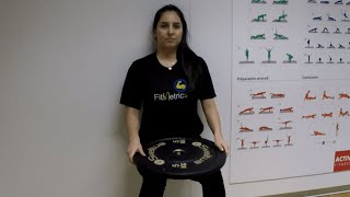 Wall Sit with Weight Disc