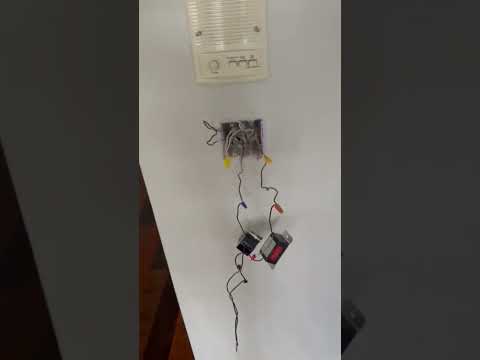 Door frame becomes energized every time egress light is turned on. We removed damaged wire.