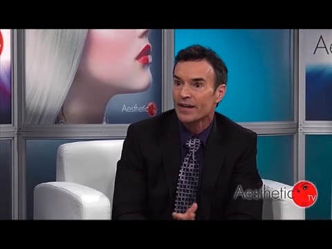 Man speaking on set of Aesthetic TV.