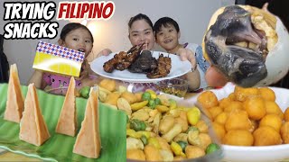 Trying FILIPINO Snacks Bini Edition | kwek kwek isaw balut