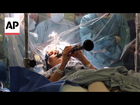 YouTube video thumbnail: Patient With Parkinson's Disease Plays Clarinet During Brain Procedure