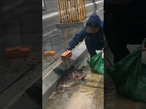 City Culvert Cleaning Leaves and Trash
