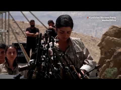 YouTube video thumbnail: PKK Fighters in Iraq Burn Weapons in Disarming Ceremony