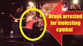 WTF? Drunk molests drummer's cymbal (I miss these Spinal tap gigs)