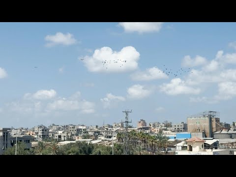 Plane drops aid over al-Bureij refugee camp in the central Gaza Strip | AFP