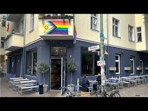 YouTube video thumbnail: How a Berlin café’s Neon Sign Welcoming the Queer Community Became a Target for Hate