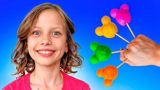 Настя играет на детской площадке с разноцветными конфетами и учит цвета | daddy finger family RU
