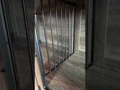 A double dog crate with a removable divider, secure doors, and a furniture-style top.