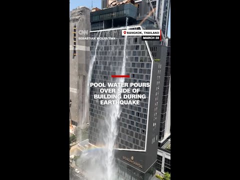 Pool water pours over side of building during earthquake