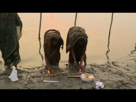 Hindu devotees bathe in India's Yamuna river to mark start of Chhath Puja | AFP