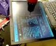 Drilling through a laptop display