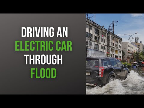 Driving An Electric Car Through Flood