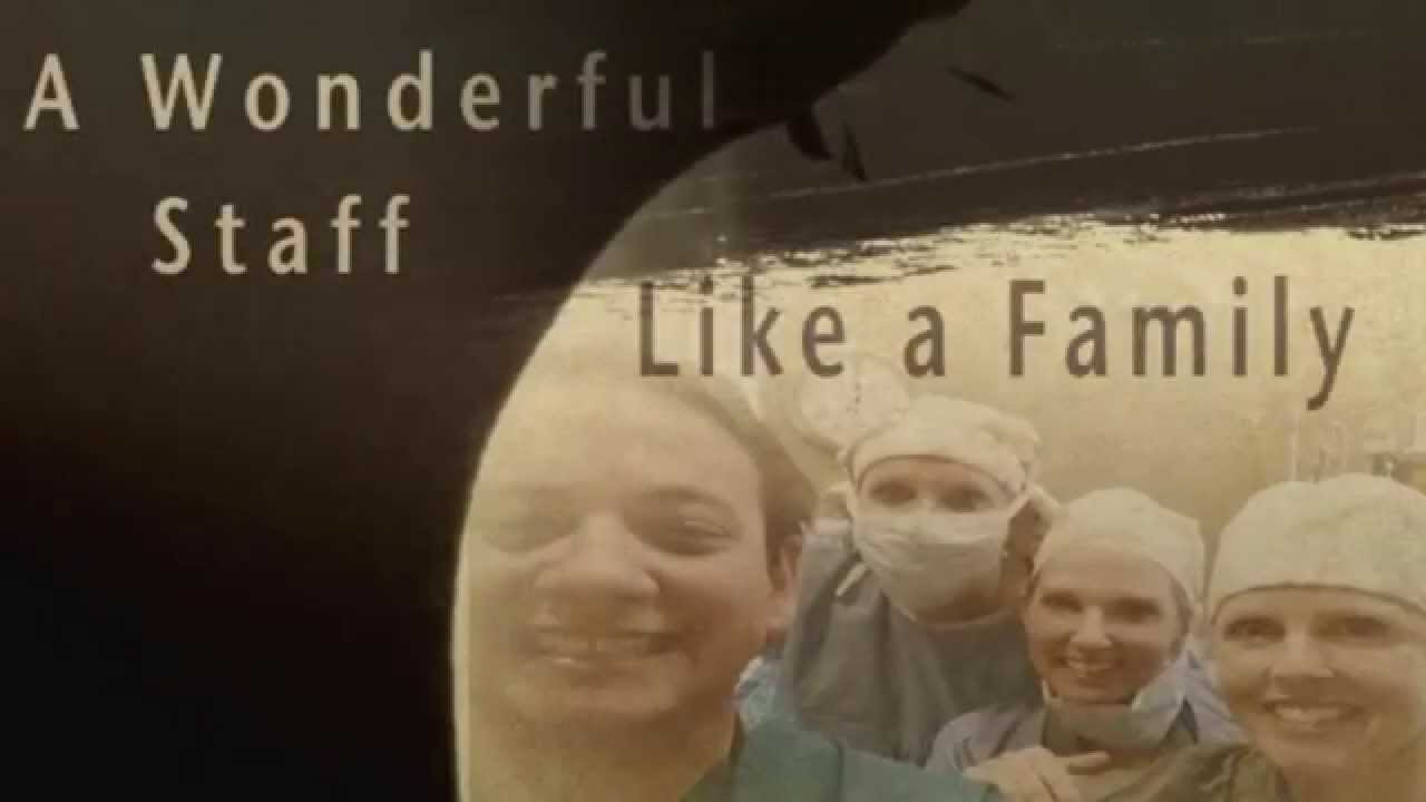 Healthcare staff smiling together, showcasing teamwork.