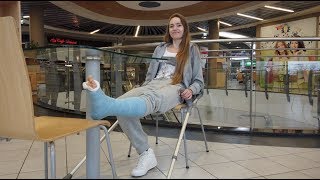 Pretty young girl with a leg in a cast broke the other leg