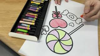 Instructions for coloring a picture of a rainbow lollipop and a heart