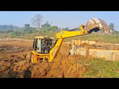 JCB 3dx super loading Mud in TAta dumper 1613