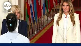 First lady Melania Trump walks with robot during White House technology summit