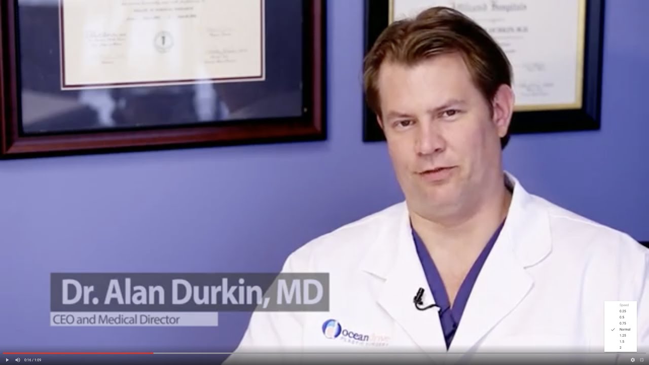 Doctor in white coat speaking to the camera.