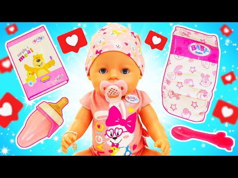 A new baby doll is crying! Maya and mom are unboxing a new baby doll and trying her accessories.