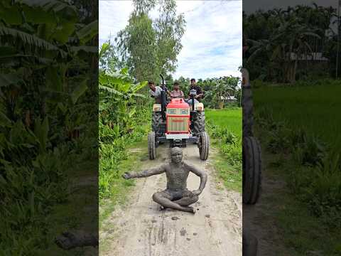 Tractor behind the statue