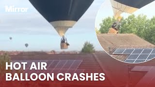 The FRIGHTENING moment a hot air balloon crashes into a home