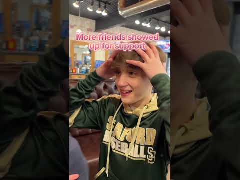 2 kids spin the wheel at BARBERCHOPS