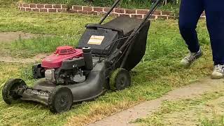Cutting Grass on Rainy Day