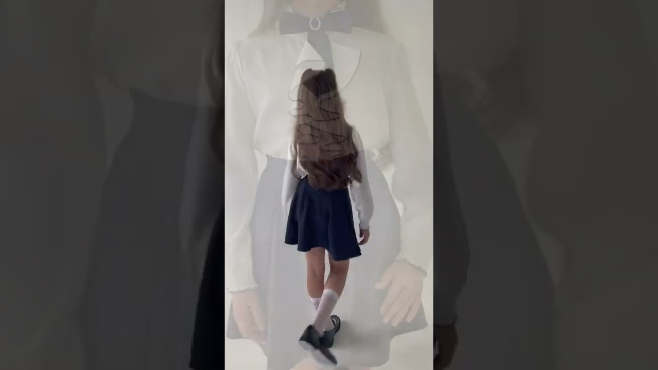 Блузка Lanson Kids с рюшами и черным бантом белая  - видео