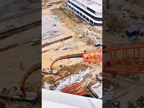 Using a large crane to transport materials to the top of the high-rise.